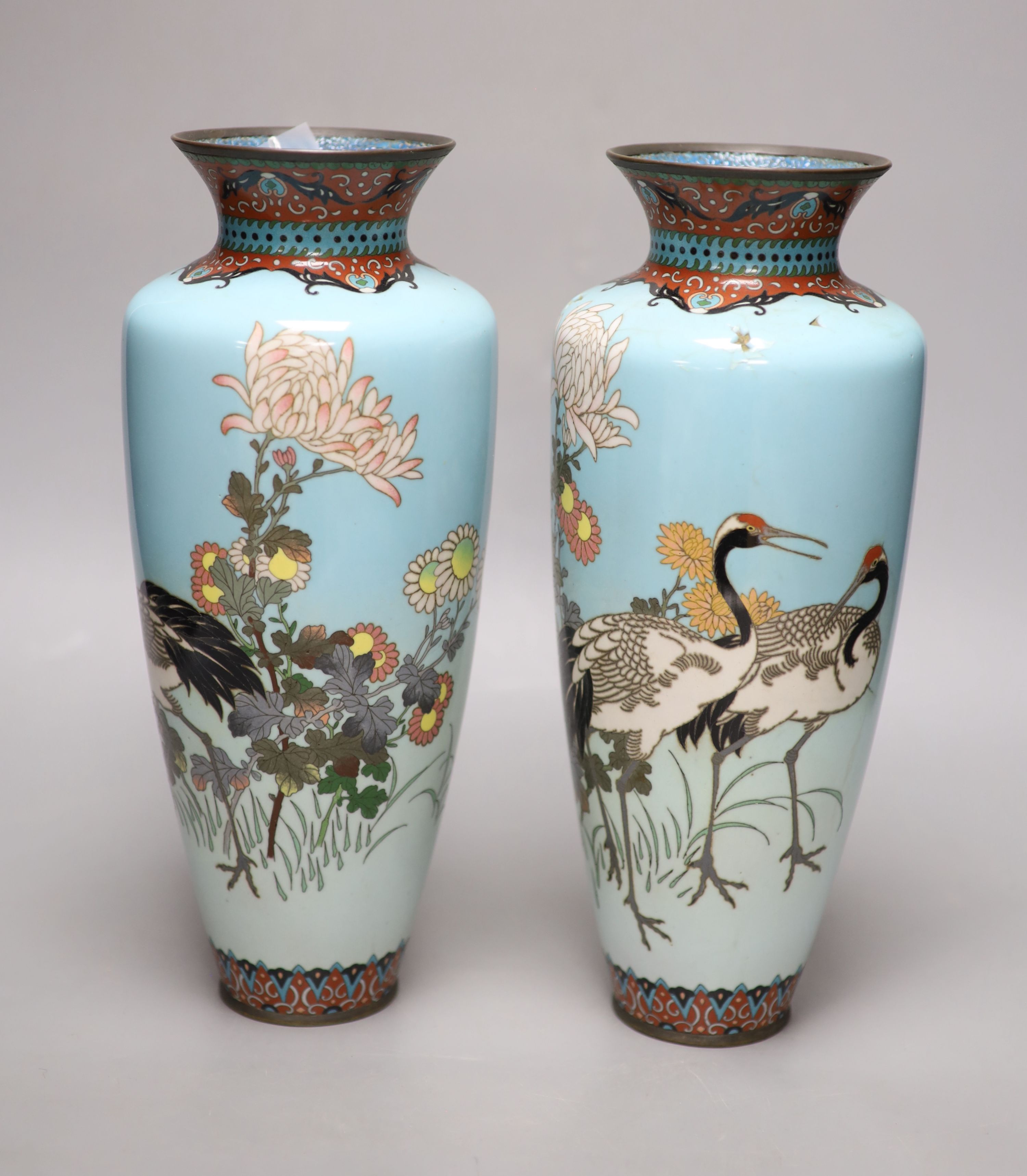 A pair of Japanese turquoise ground cloisonne enamel vases, a large cloisonne bowl and smaller matching bowl, tallest 31cm